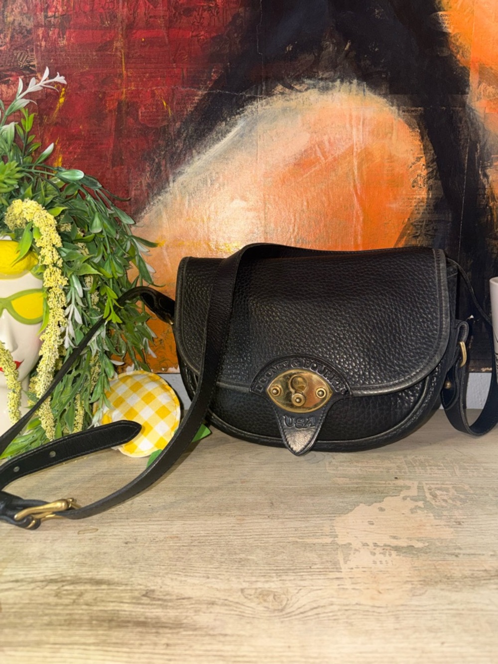 Dooney & Bourke Black Pebbled Leather Crossbody Saddle Bag with Brass Hardware